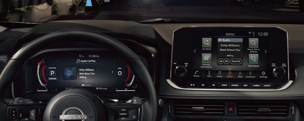 Interior view of a 2022 Nissan Rogue steering wheel