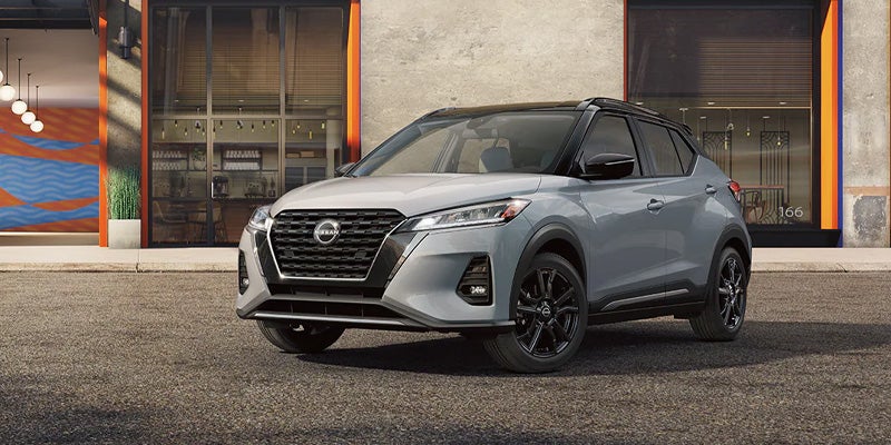 A 2024 Nissan Kicks parked outside a chic shop near Medina, OH