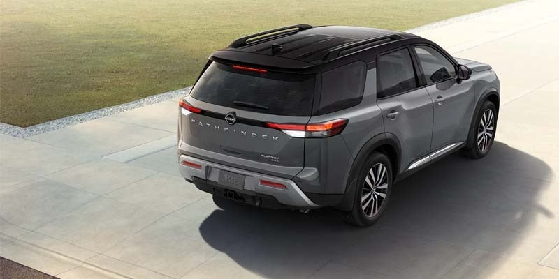 A 2024 Nissan Pathfinder rushing by on a road near Medina, OH