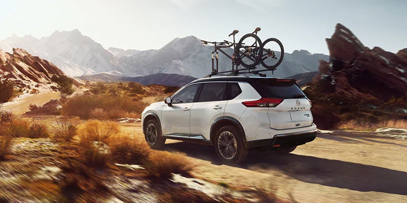 A 2024 Nissan Rogue carrying around bicycles that has driven out to a place to ride them in Medina, OH