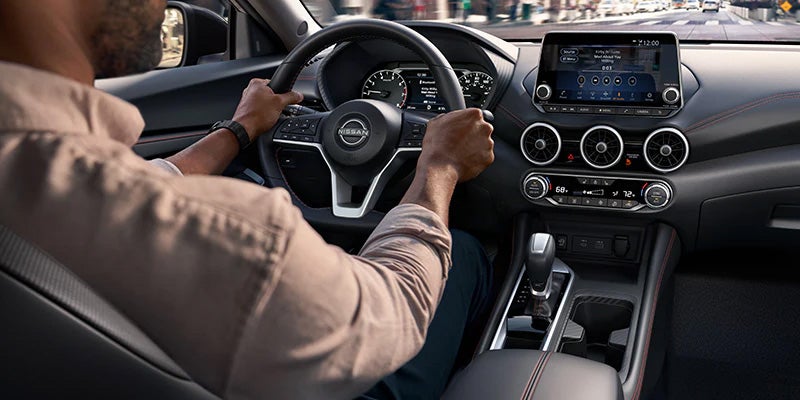 A driver utilizing the powerful engine of the 2024 Nissan Sentra in Medina, OH