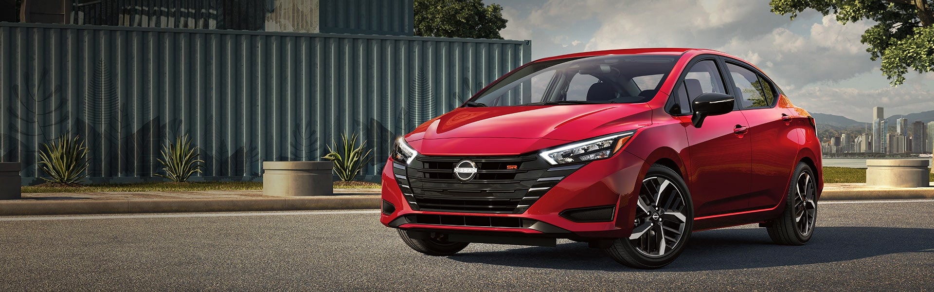 A woman driving a 2024 Nissan Versa in Medina, OH