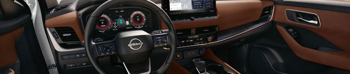 The center dashboard and console of the 2025 Nissan Rogue in Medina, OH